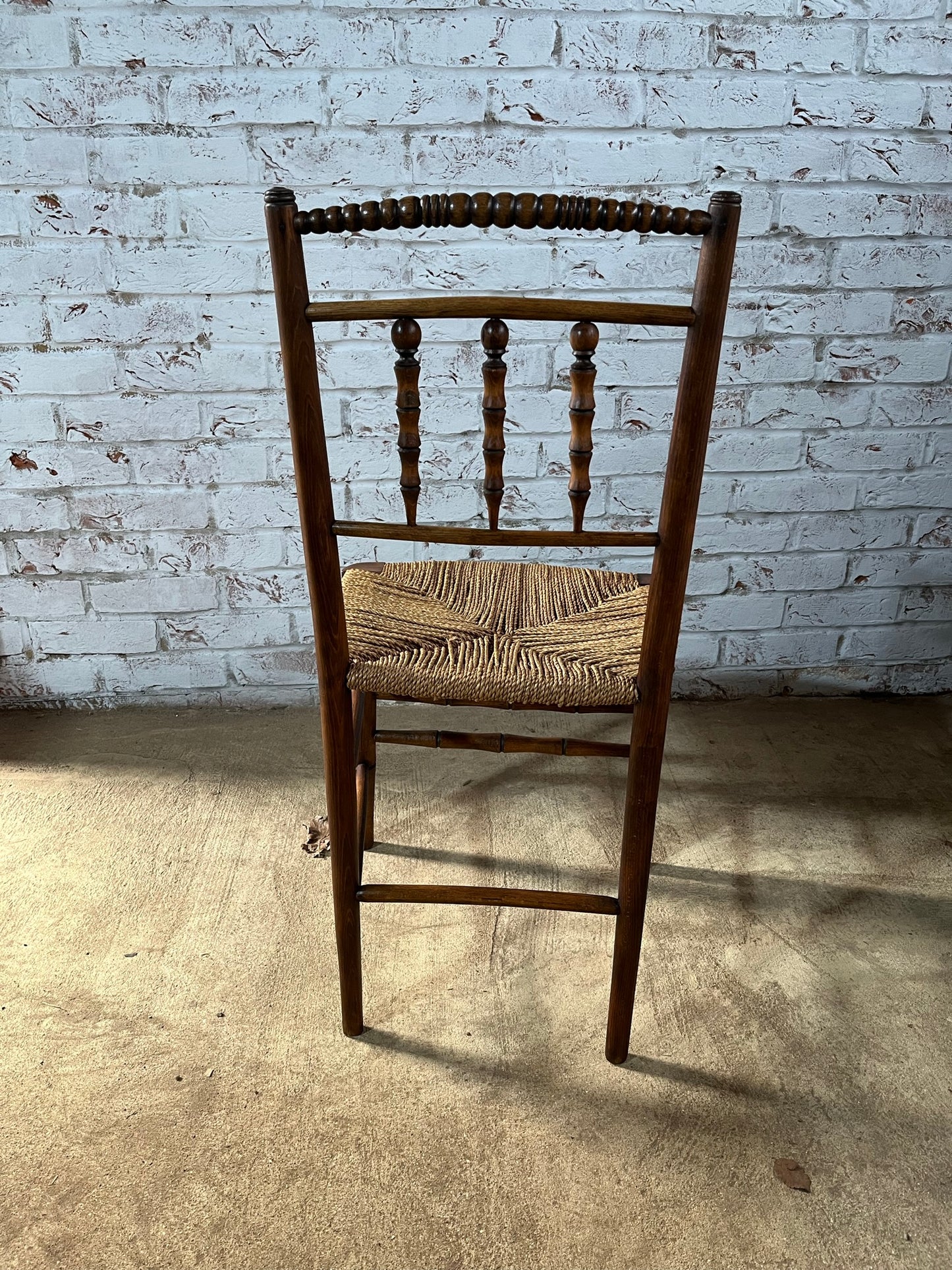 Antique spindle and bobbin back country side chair.