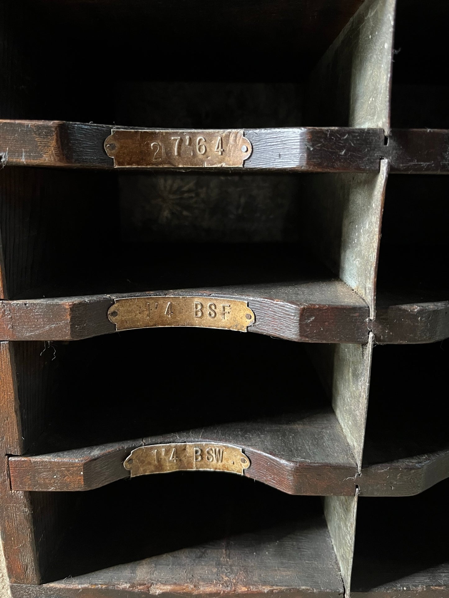 A vintage pine and metal industrial pigeon hole cabinet.