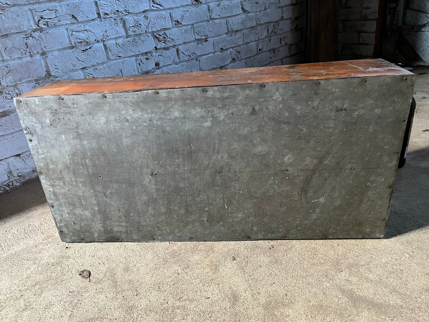 A vintage pine and metal industrial pigeon hole cabinet.