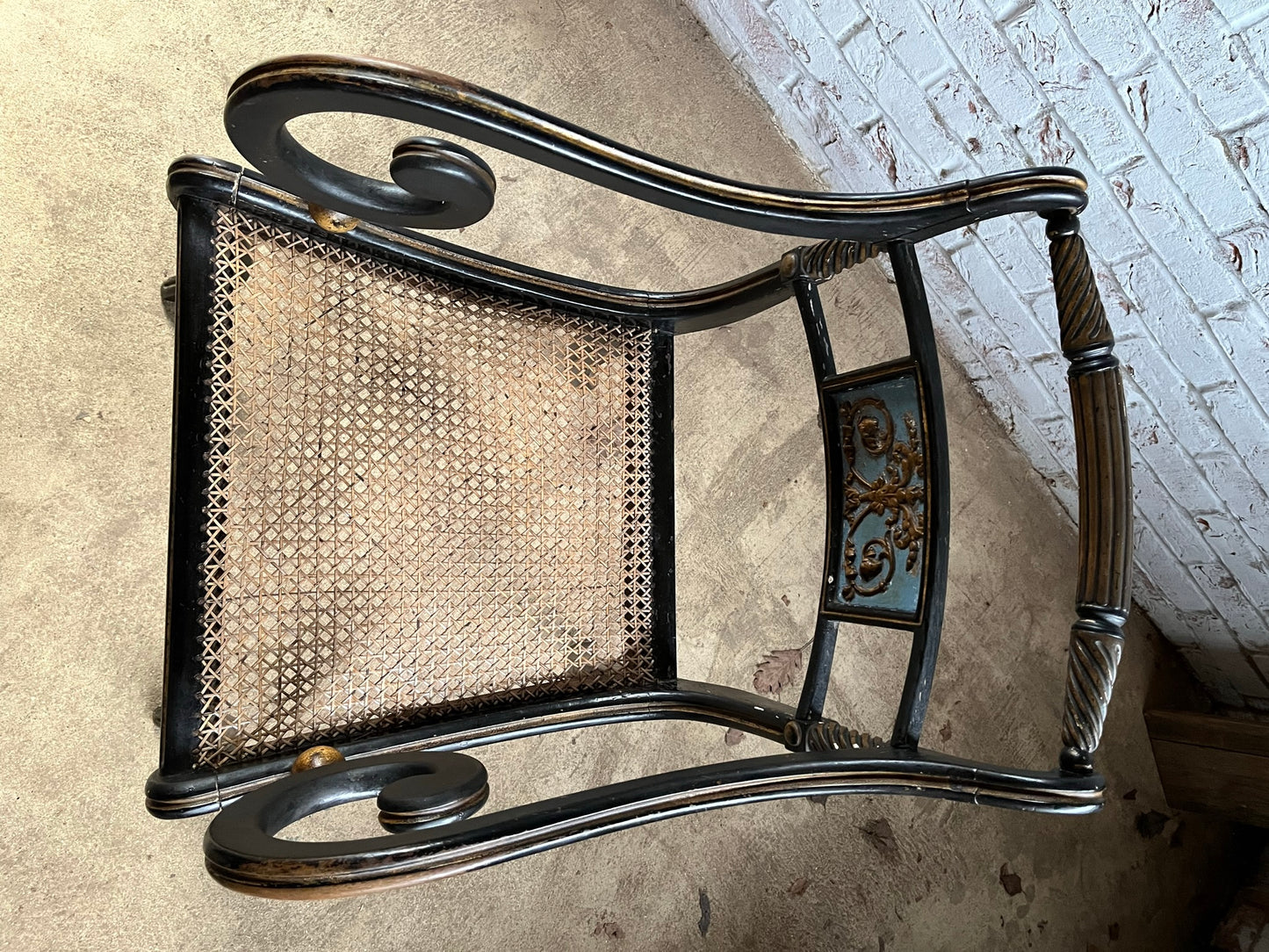 Regency ebonised and painted armchair.
