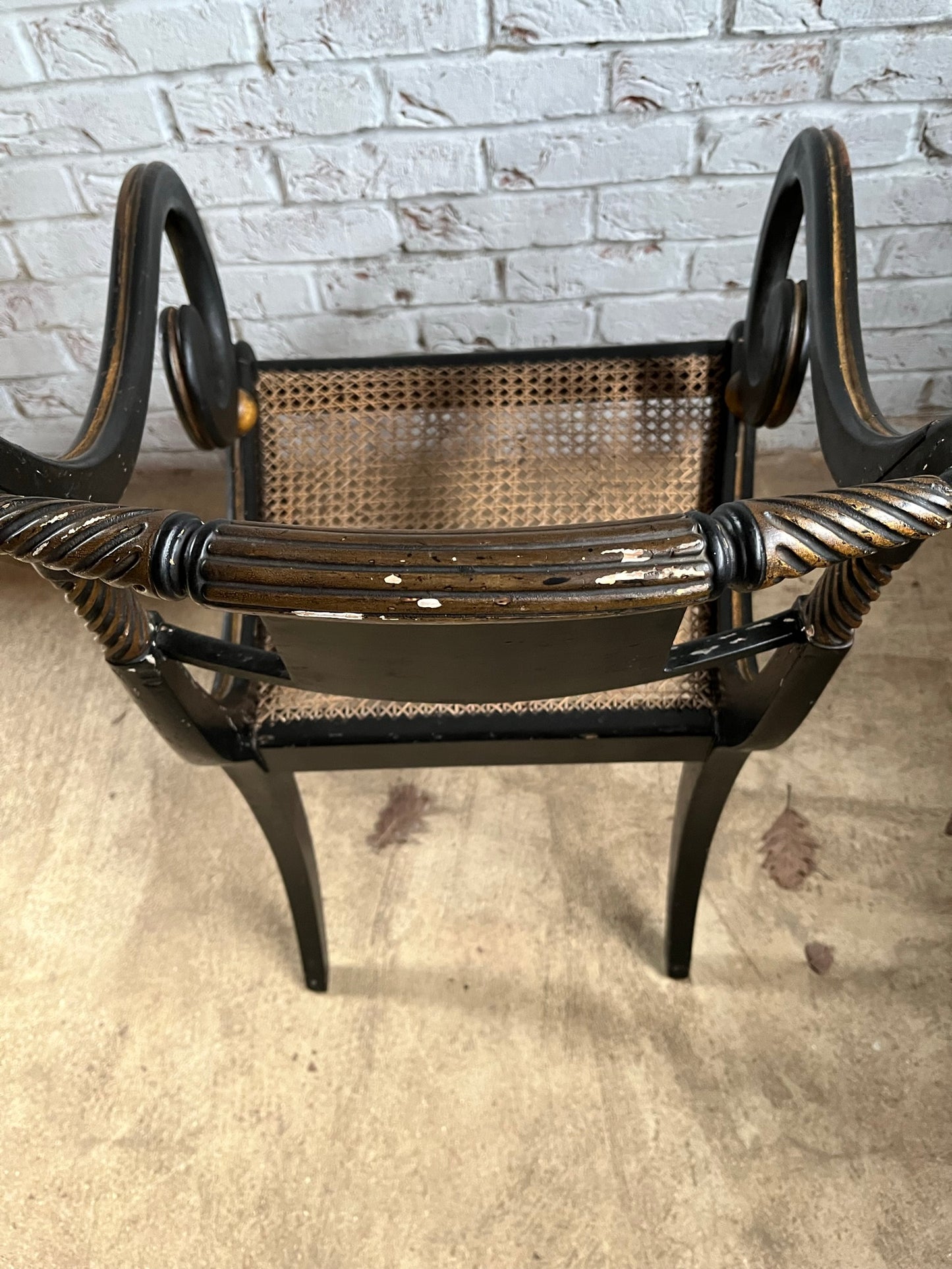 Regency ebonised and painted armchair.