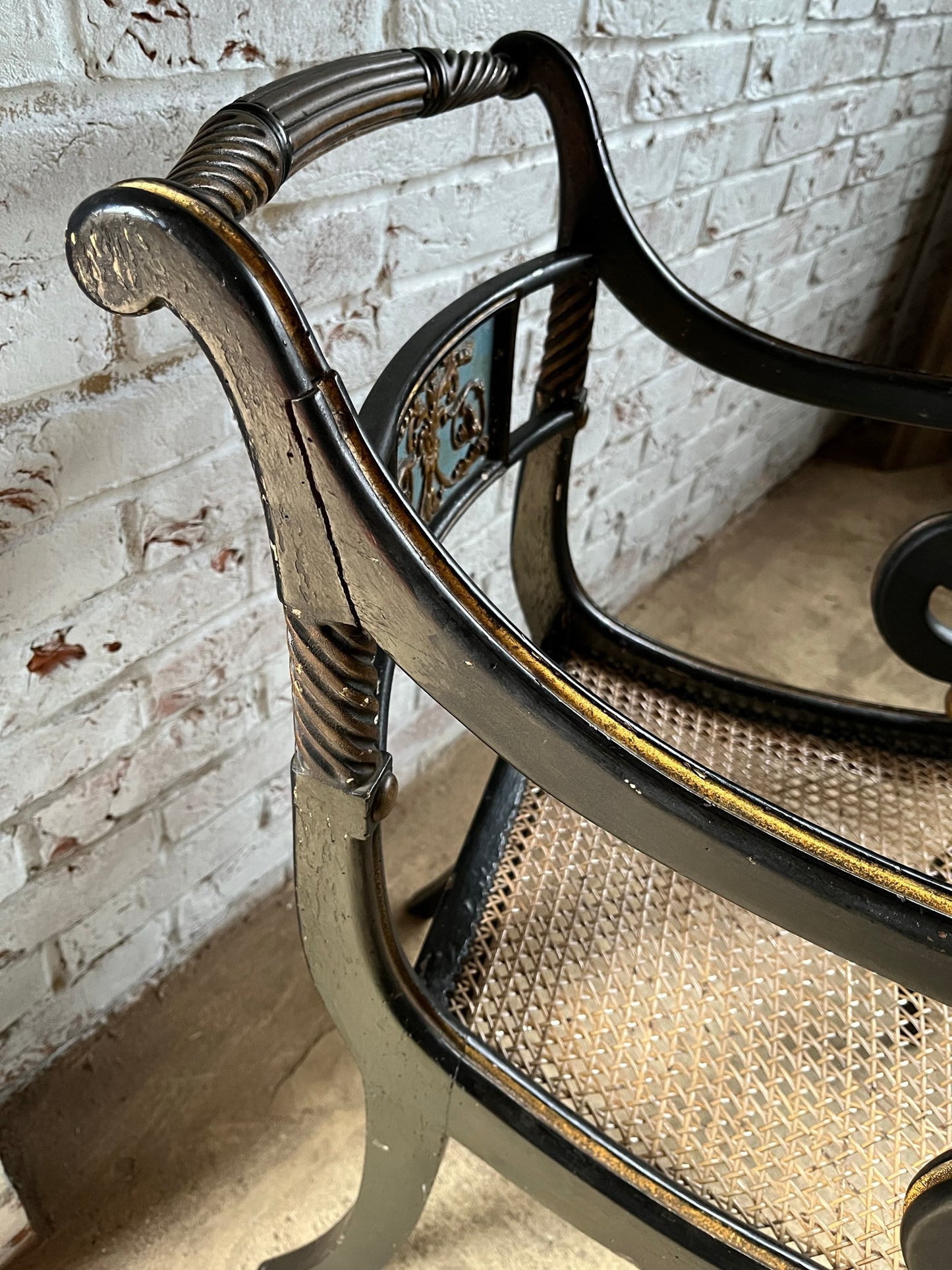 Regency ebonised and painted armchair.