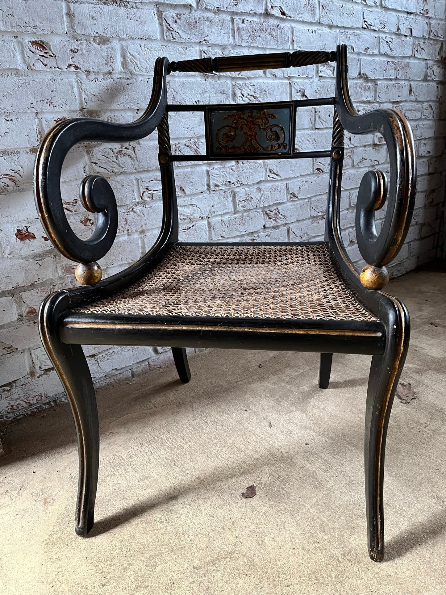 Regency ebonised and painted armchair.