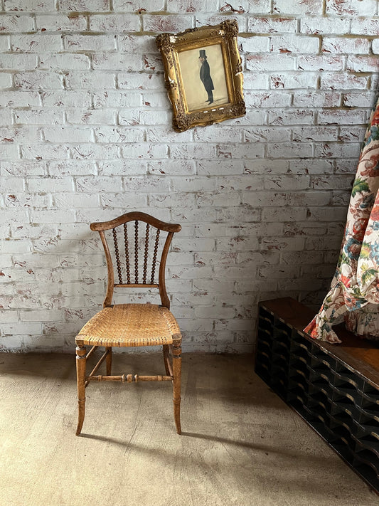 Chair with lyre-shaped back and bobbin back splat.