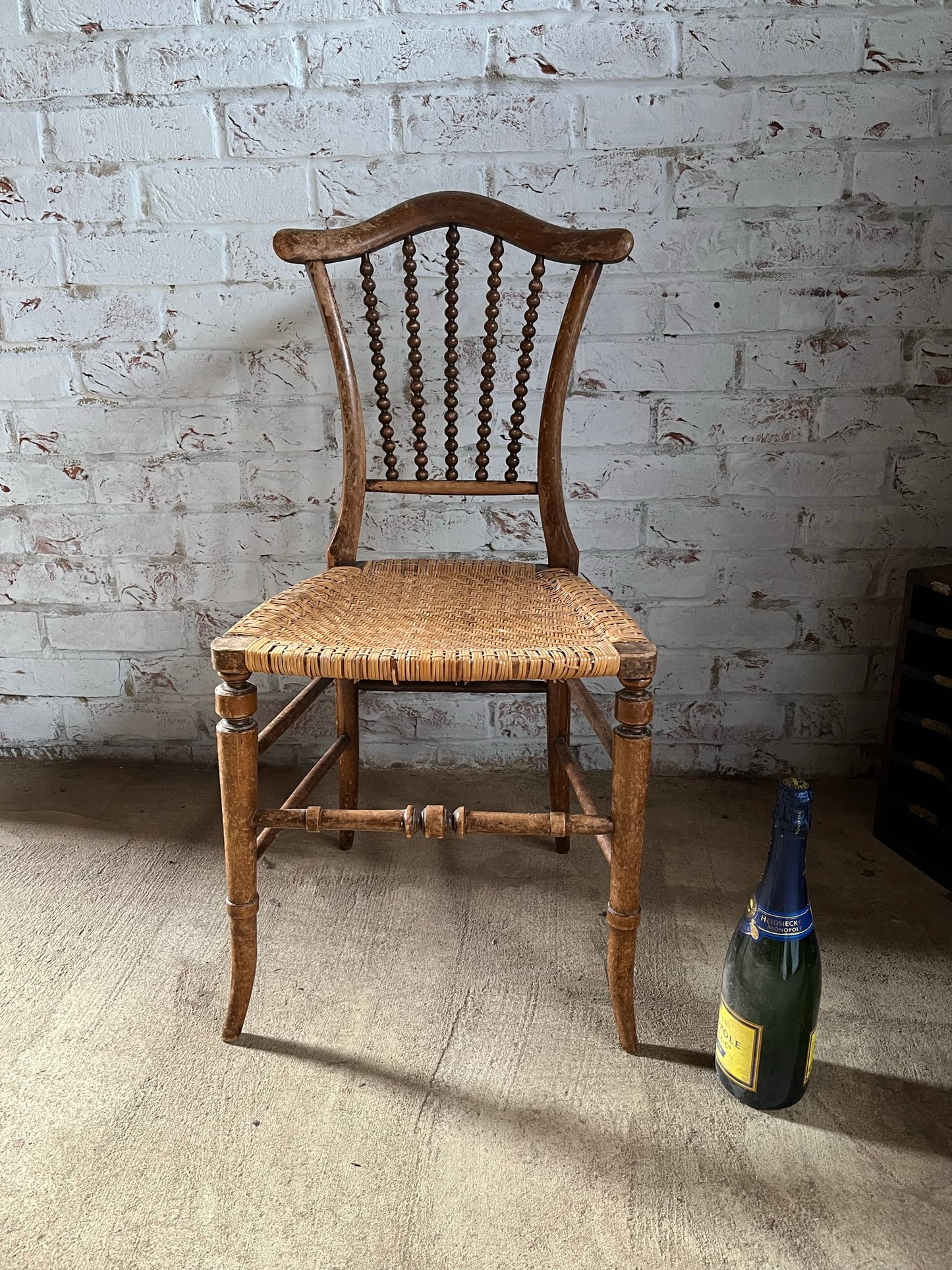 Chair with lyre-shaped back and bobbin back splat.