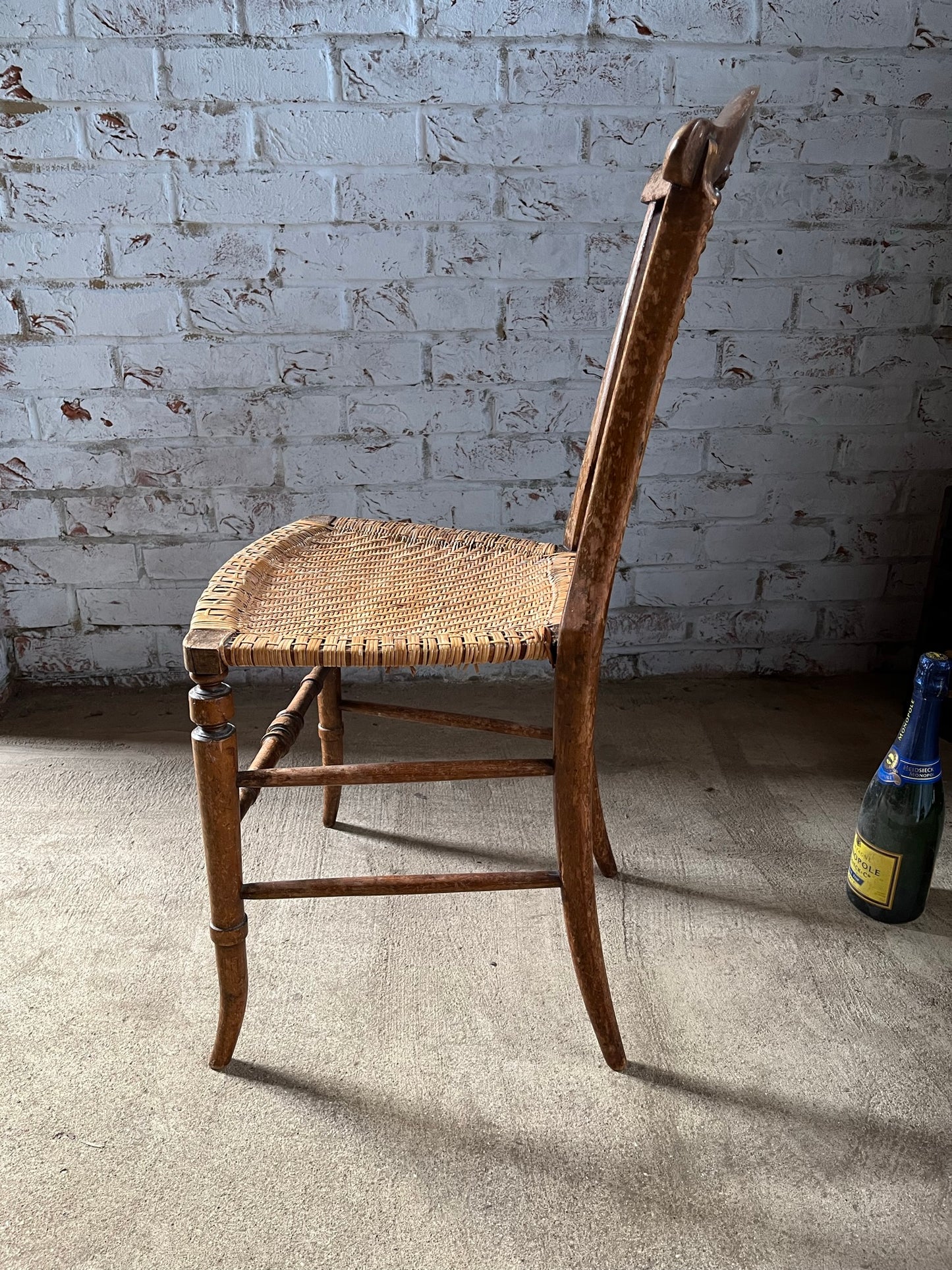 Chair with lyre-shaped back and bobbin back splat.