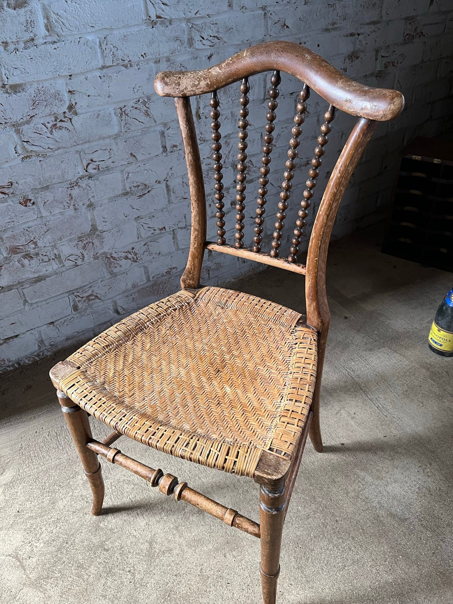 Chair with lyre-shaped back and bobbin back splat.