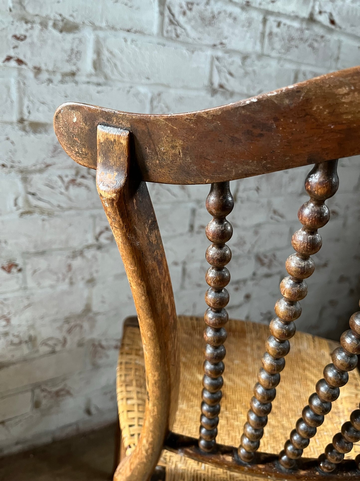Chair with lyre-shaped back and bobbin back splat.
