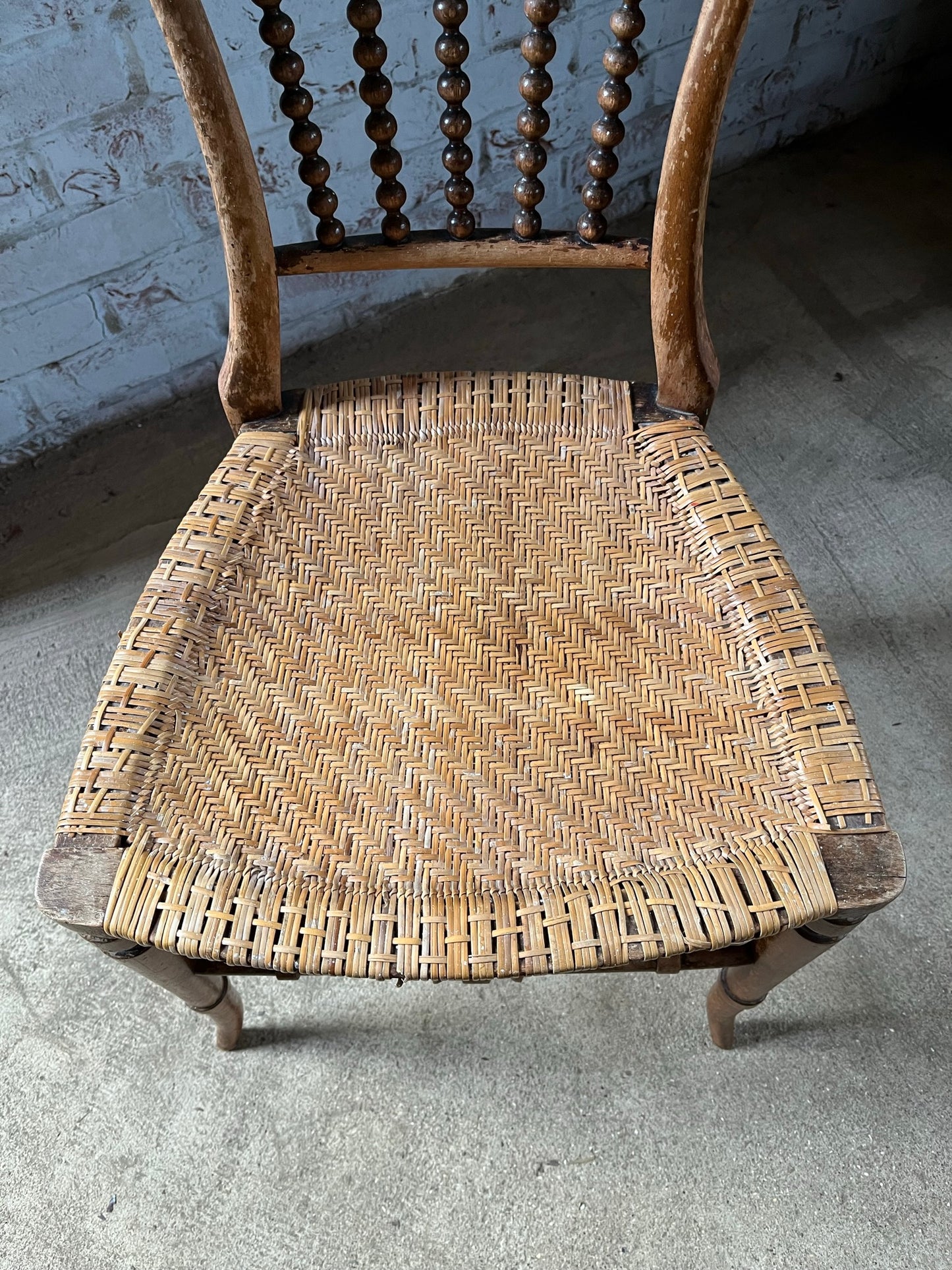 Chair with lyre-shaped back and bobbin back splat.
