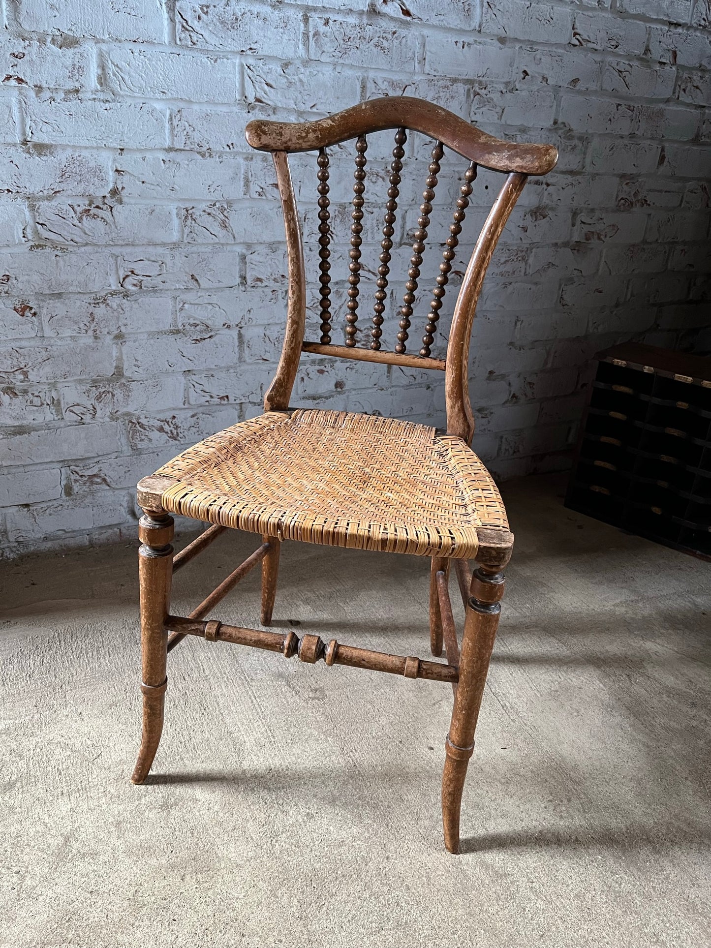 Chair with lyre-shaped back and bobbin back splat.