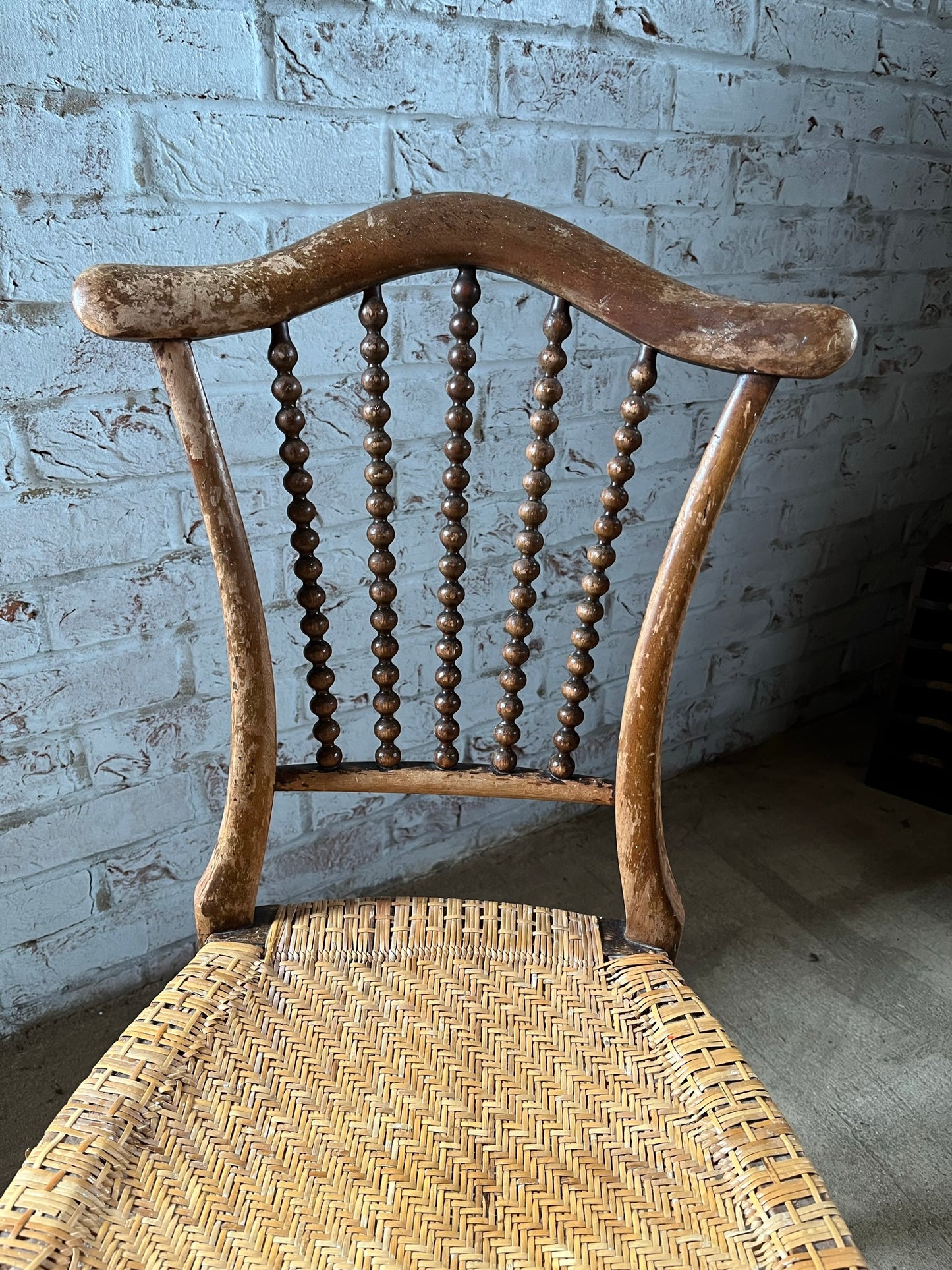 Chair with lyre-shaped back and bobbin back splat.